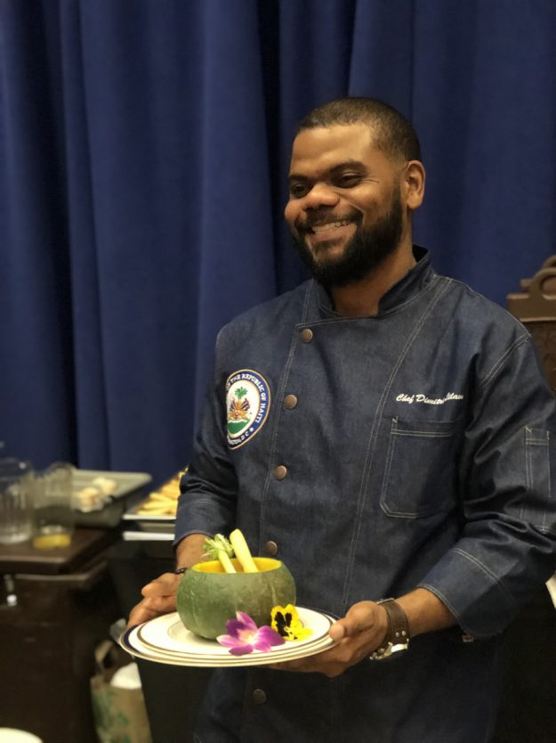 Chef Dimitri serving the dish